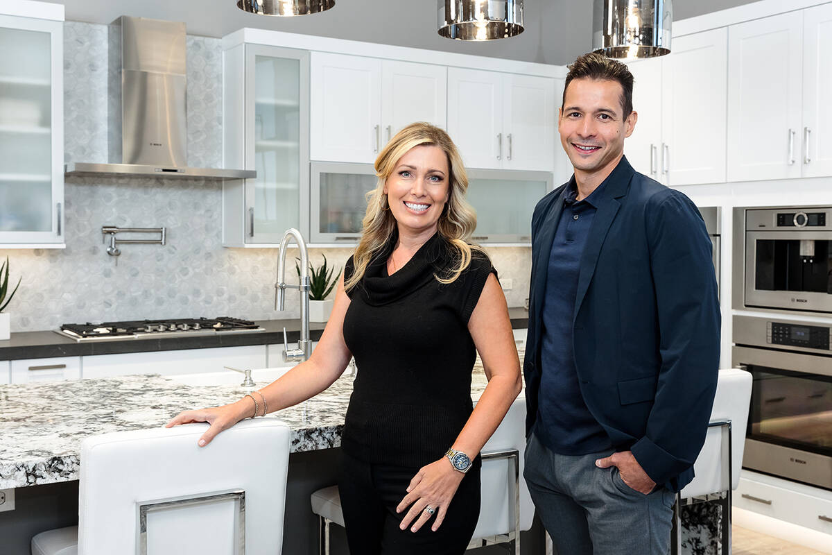 Natalie Brown, left, and Pascual P.J. Ortiz, work together as a successful Tri Pointe Homes sal ...
