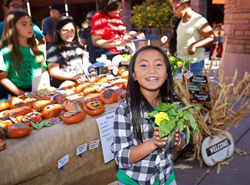 Bartlett Elementary School student Penelope Wong, 9, sells products on Thursday, Oct. 20, 2022, ...