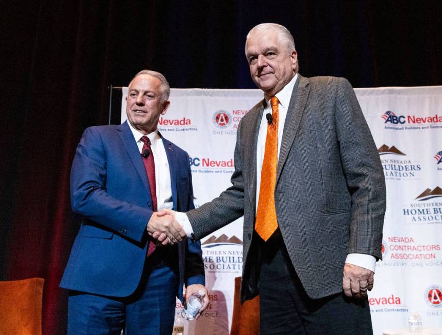 Gov. Steve Sisolak, right, and Sheriff Joseph Lombardo shake hands after meeting with the const ...