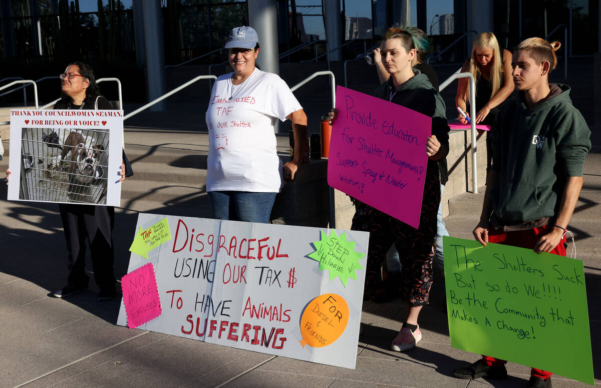 Protesters of The Animal Foundation shelter, including from right, Kayden Reichenbach, Cheyane ...