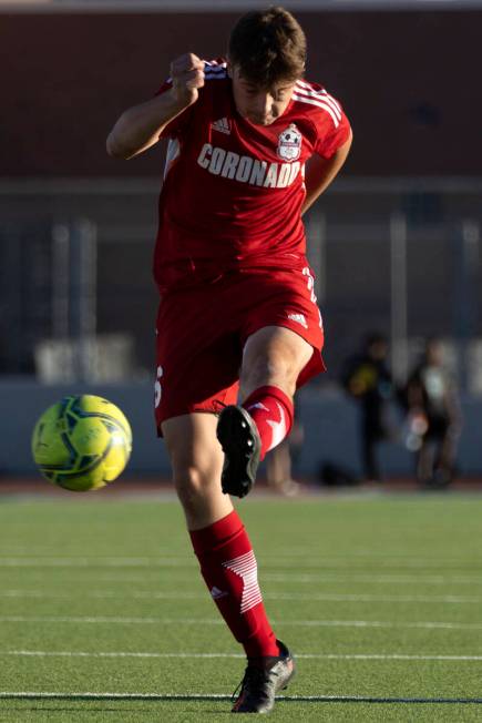 Coronado’s Anthony Sena kicks a pass during a boys high school soccer game against Ranch ...