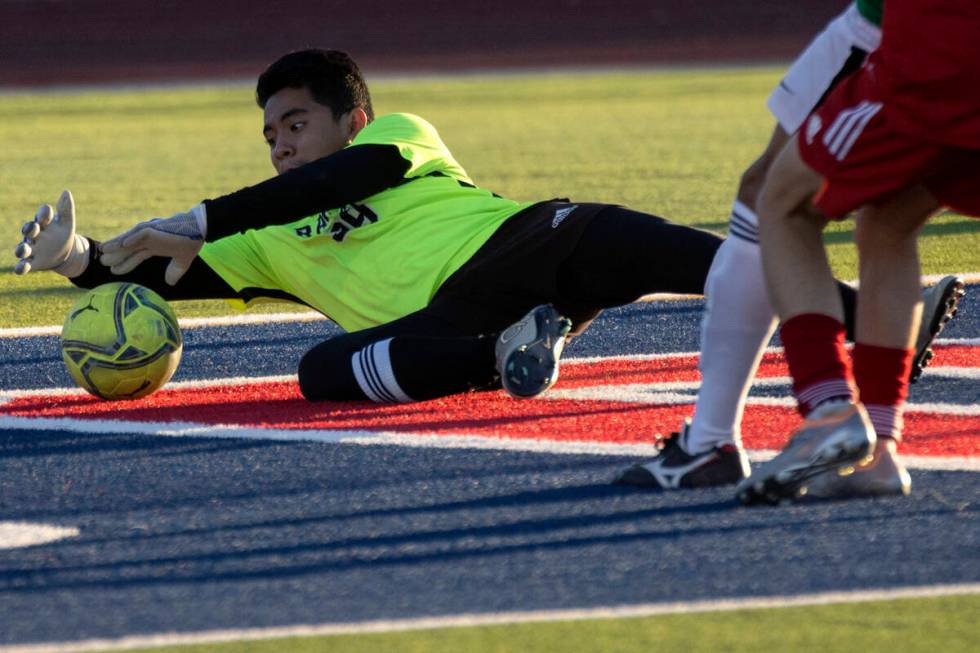 Rancho goalkeeper Fernando Beltran saves an attempted goal by Coronado during a boys high schoo ...