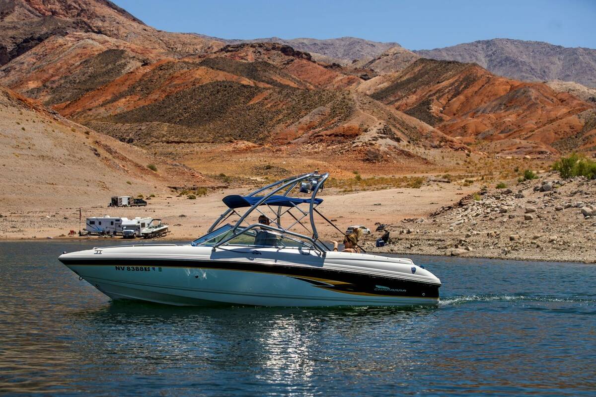 Boaters cruise past the Kingman Wash area within the Lake Mead National Recreation Area on Thur ...