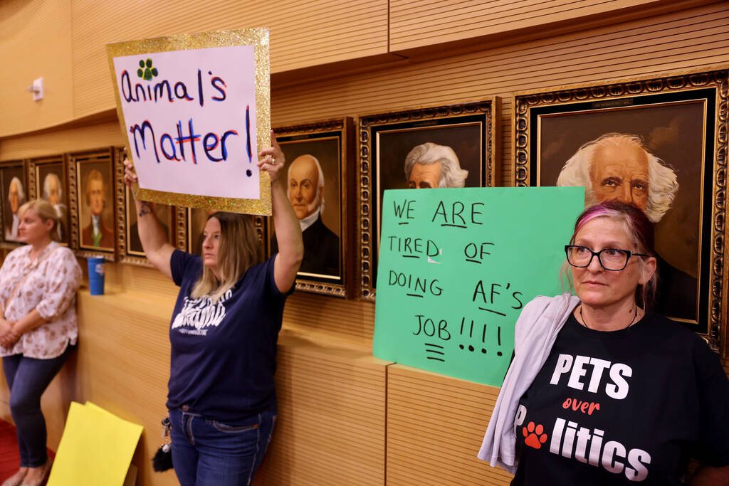 Protesters of The Animal Foundation shelter, including Tracy Paz, right, and Judy Marshall, dur ...