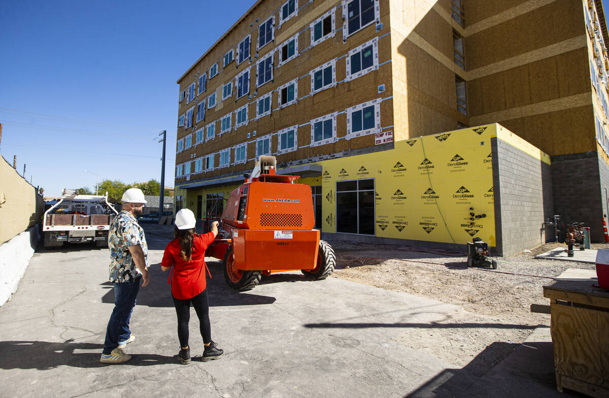 Tiffany Brown, property manager at ShareDOWNTOWN, right, gives a tour to a prospective tenant a ...