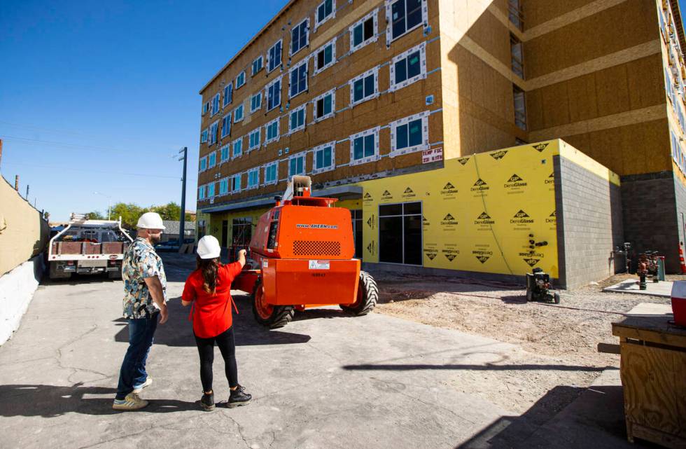 Tiffany Brown, property manager at ShareDOWNTOWN, right, gives a tour to a prospective tenant a ...