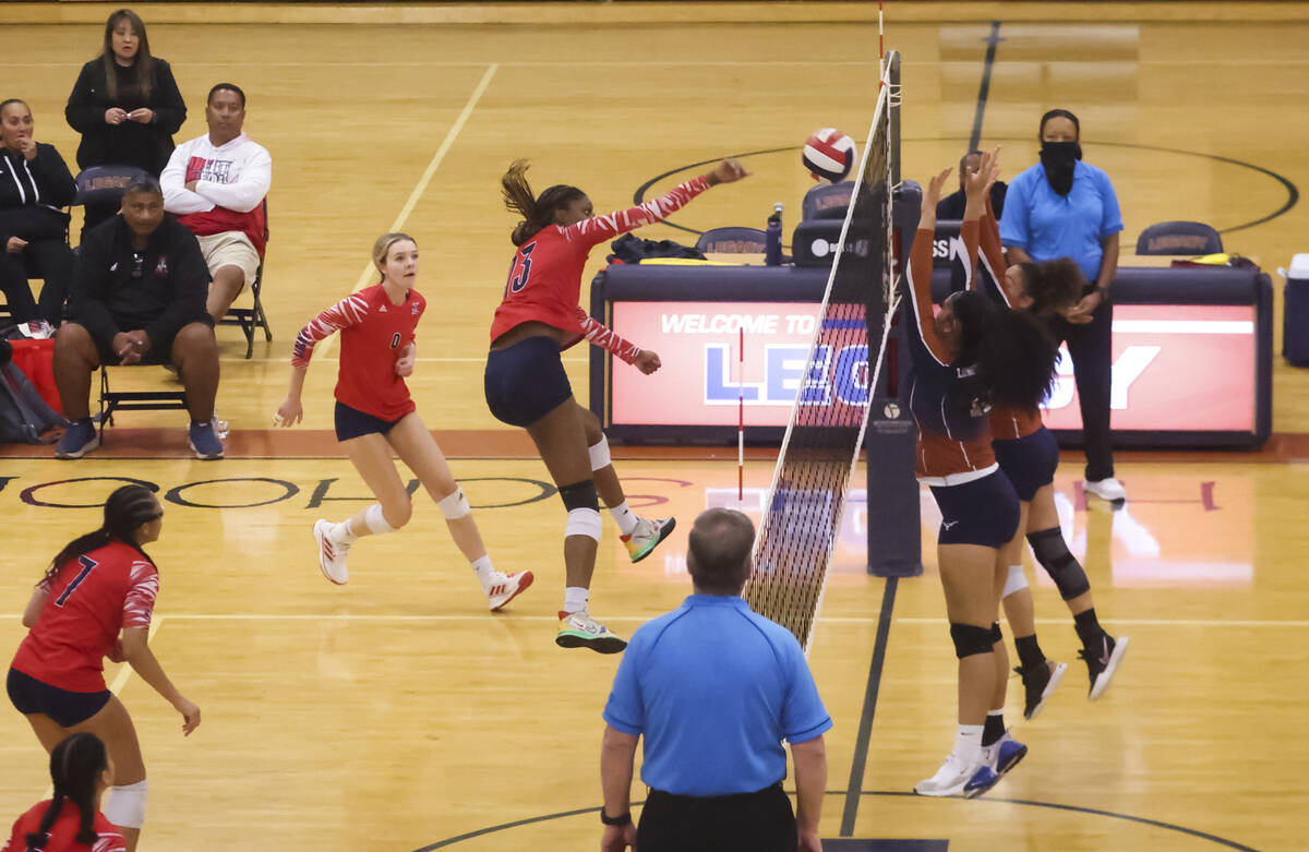 Liberty's AMAYA TOBIAS (13) hits the ball as Legacy defends during a volleyball game at Legacy ...