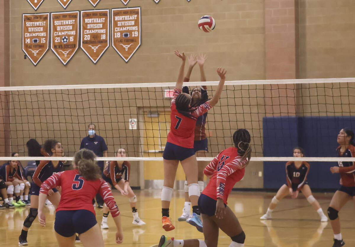 Liberty's Jayda Hutchins (7) looks to defend as Legacy's Kiana Peterson goes for the ball durin ...