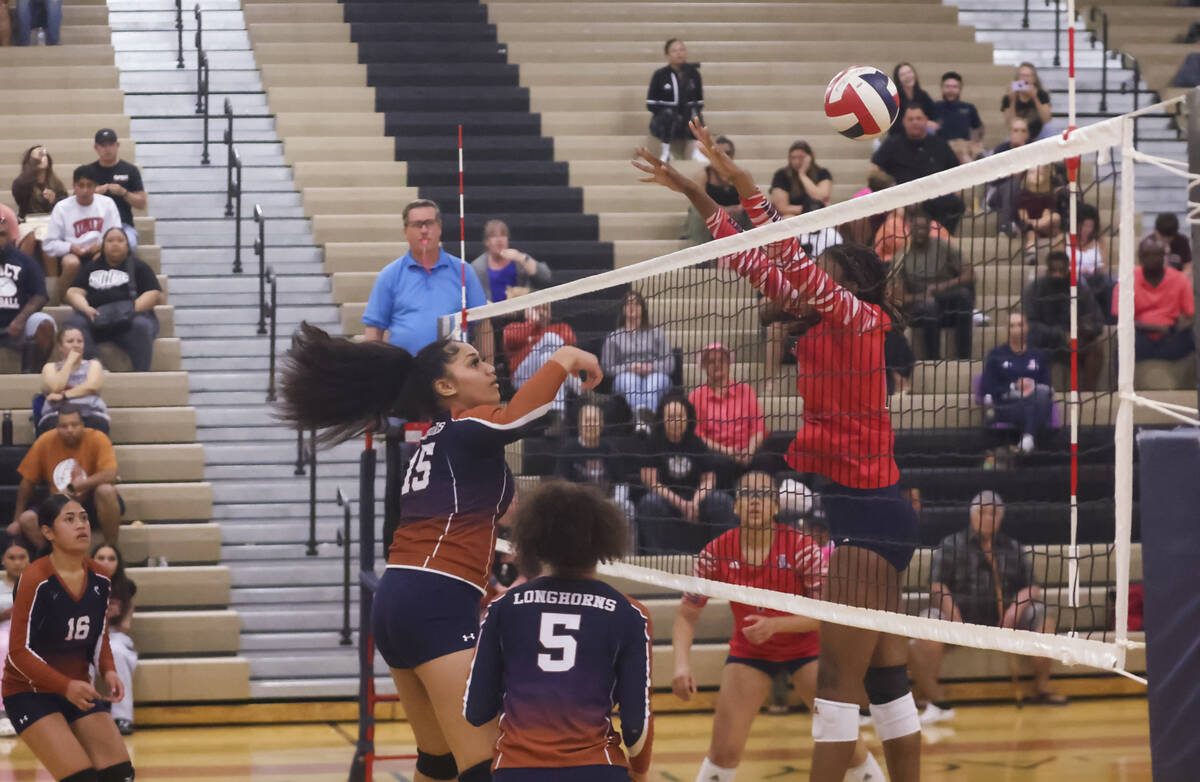 Legacy's Siunipa Mauga (15) sends the ball over the net against Liberty during a volleyball gam ...