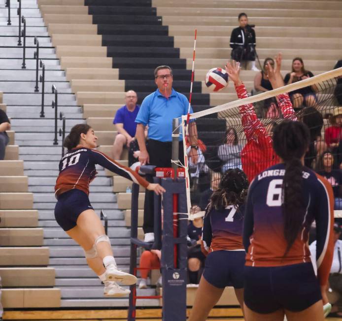 Legacy's Jocelyn Taveras (10) sends the ball over as Liberty defenders make the block during a ...
