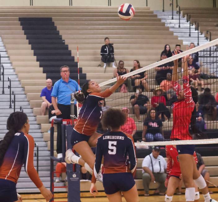 Legacy's Kiana Peterson (7) eyes the ball as Liberty defends during a volleyball game at Legacy ...