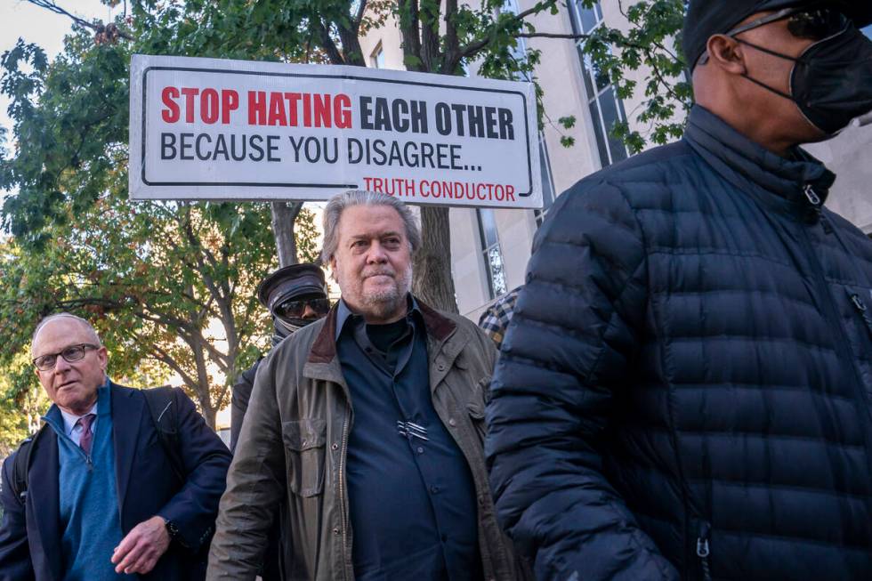 Steve Bannon, center, a longtime ally of former President Donald Trump, convicted of contempt o ...