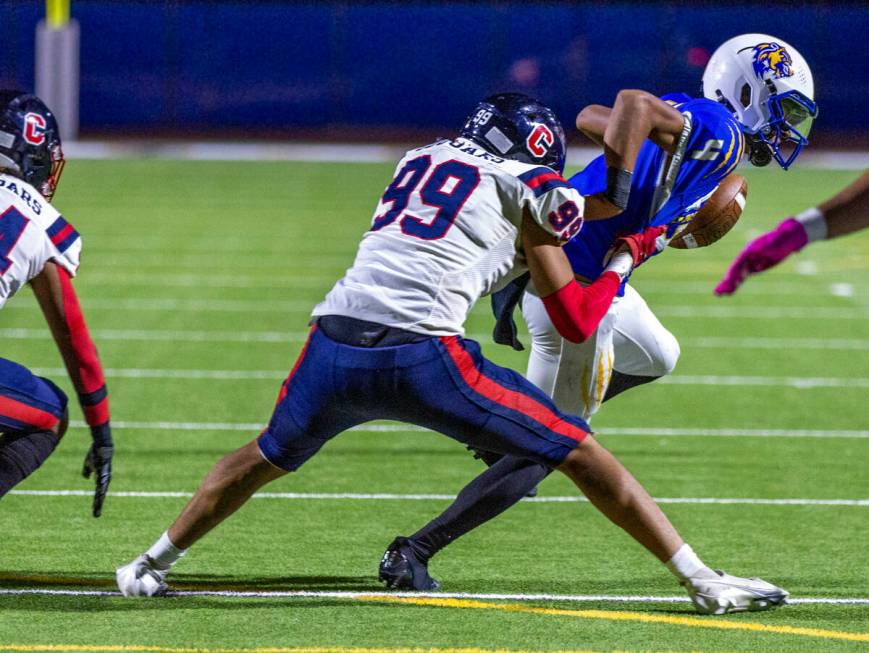 Coronado DE Davion Martinez (99) makes a critical court down stop on Sierra Vista QB Tarrance M ...