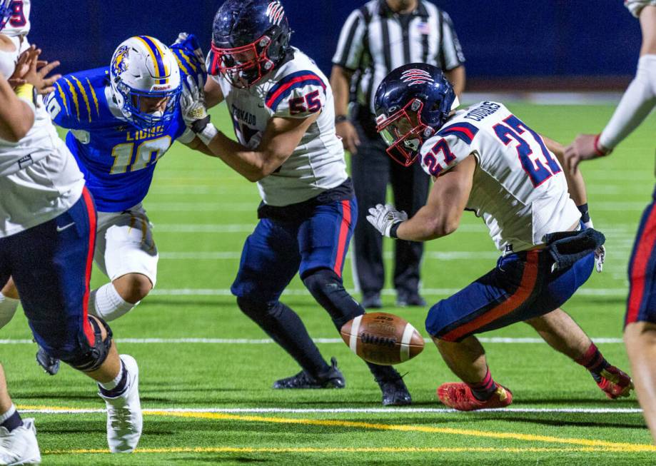 Coronado RB Mohammad Maali (27) looks to a fumble near the end zone as OL Conall Mosteller (55) ...