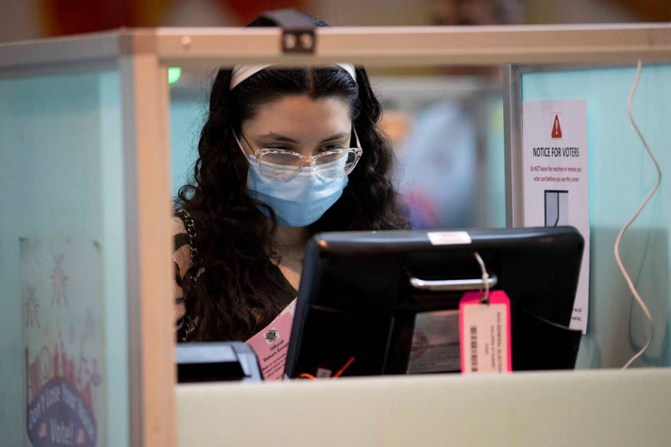 Amira Ezzarhri, 18, casts her vote at the polling place inside of the Galleria at Sunset shoppi ...