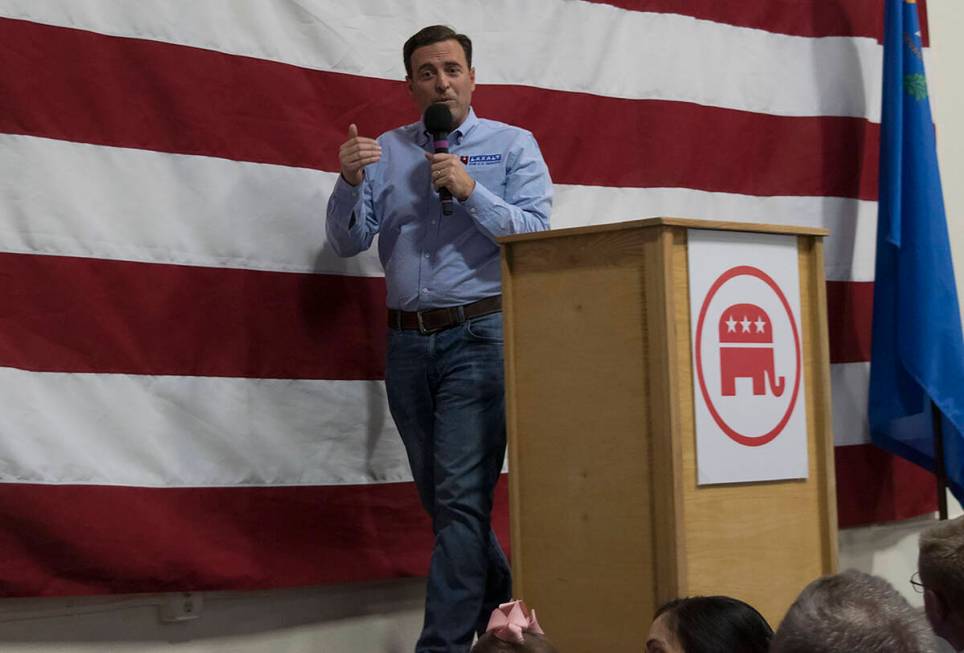 Adam Laxalt, Republican candidate for U.S. senator, speaks to a rally in South Reno on Saturday ...