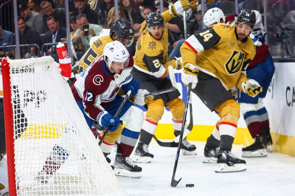 Colorado Avalanche center Jayson Megna (12) and Vegas Golden Knights defenseman Nicolas Hague ( ...