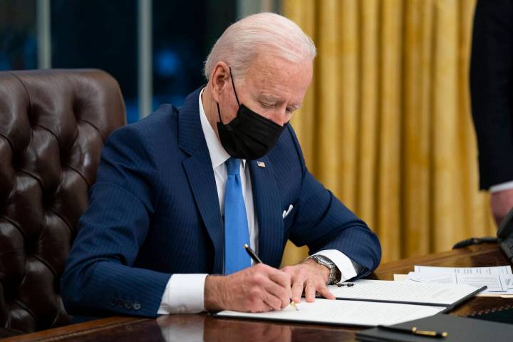 FILE - In this Feb. 2, 2021, file photo President Joe Biden signs an executive order on immigra ...