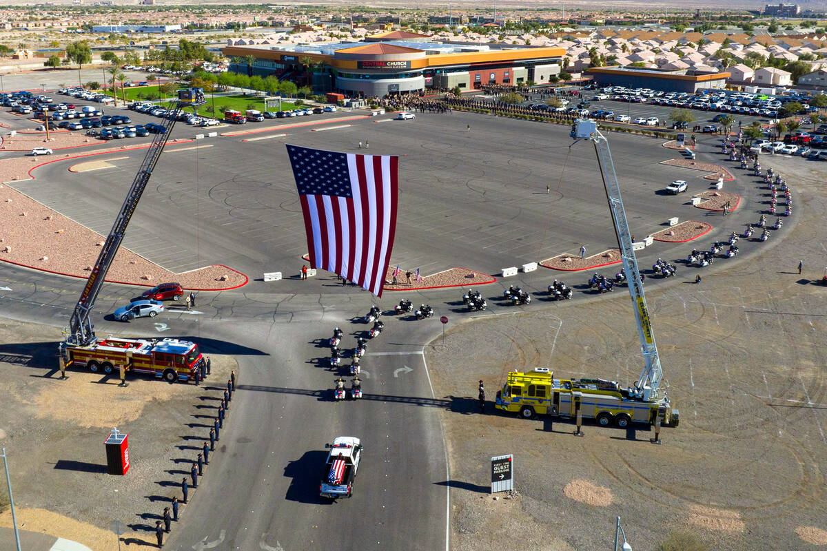 A hearse carrying the casket of fallen Las Vegas police officer Truong Thai arrives at Central ...