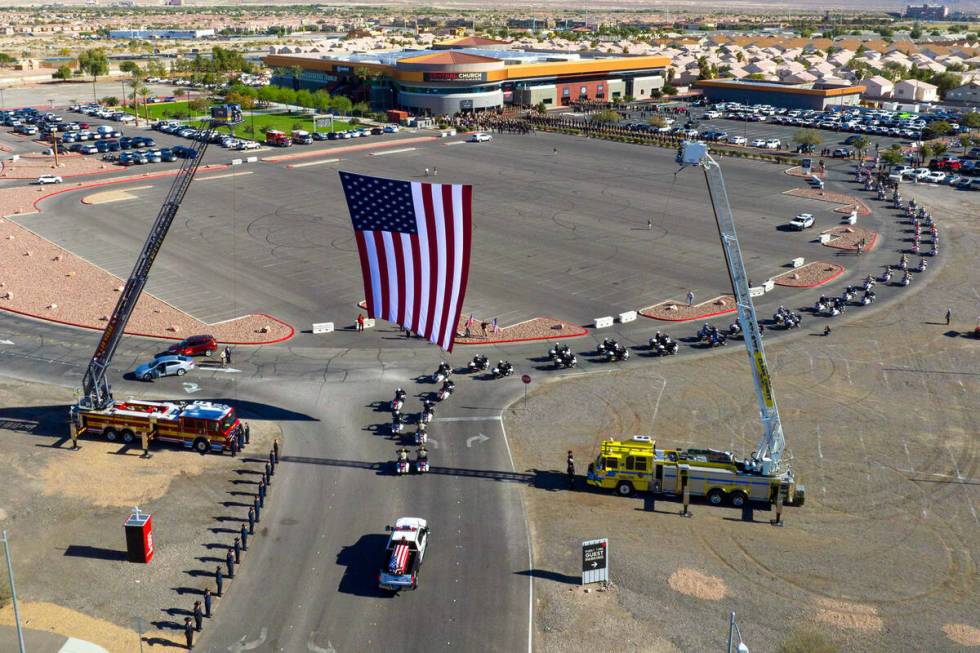 A hearse carrying the casket of fallen Las Vegas police officer Truong Thai arrives at Central ...