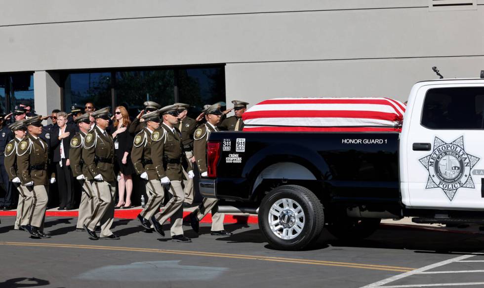 Officers salute as the procession for fallen Las Vegas police officer Truong Thai arrives at Ce ...