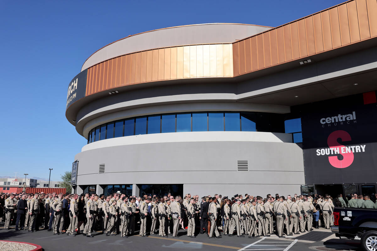 Officers follow the casket into Central Church in Henderson during the funeral of fallen Las Ve ...