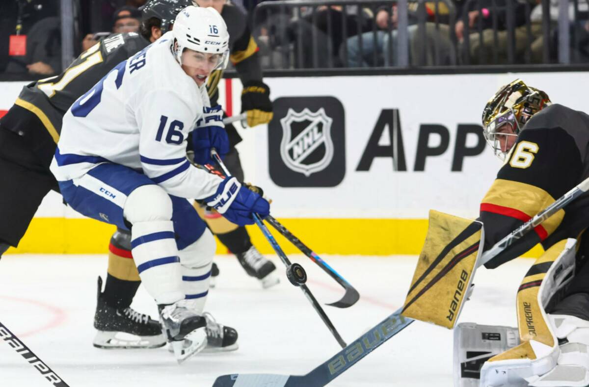 Toronto Maple Leafs right wing Mitchell Marner (16) tries to get the puck in against Vegas Gold ...