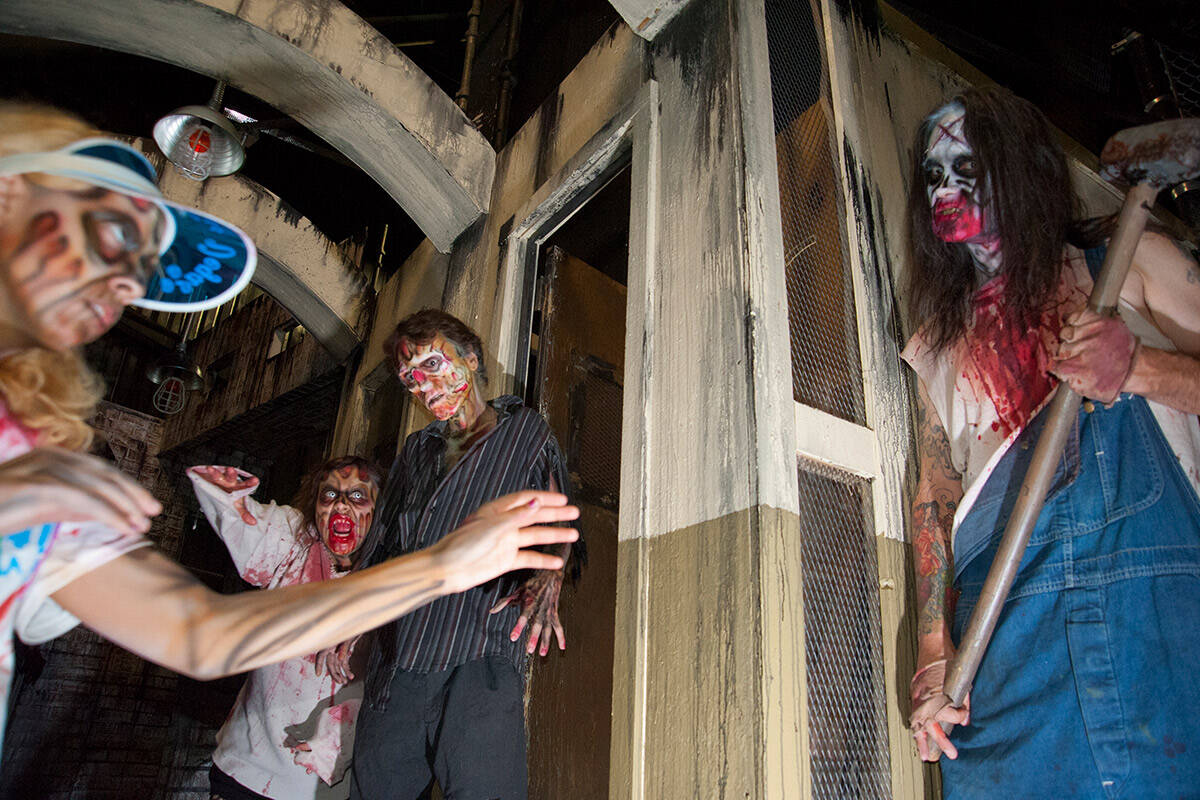 Actors in character participates in a run-through for zombies, monsters and demonic clowns for ...