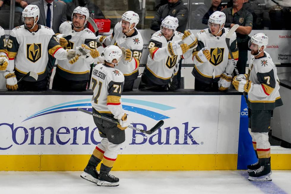 Vegas Golden Knights center William Karlsson (71) celebrates with teammates after scoring again ...