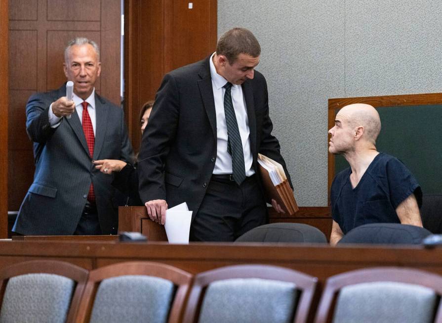 District Attorney Steve Wolfson, left, enters the courtroom as Robert Telles, right, and his at ...