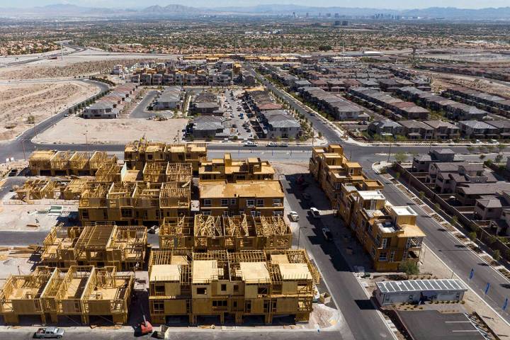 Construction is underway for new development as existing homes are seen from Desert Foothills D ...