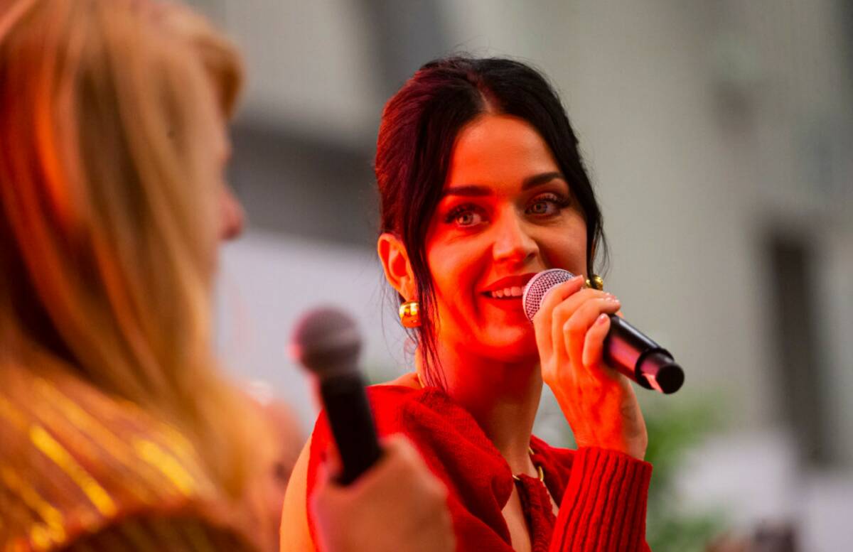 Katy Perry, right, talks with moderator Booth Moore during the MAGIC Las Vegas fashion trade sh ...