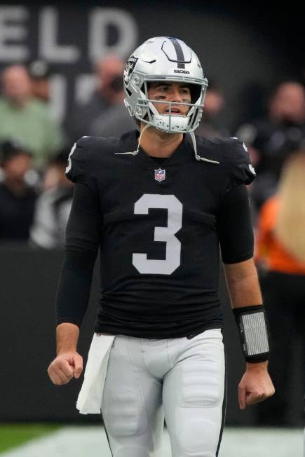 Las Vegas Raiders quarterback Jarrett Stidham (3) watches action during an NFL football game ag ...