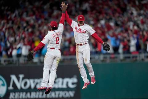 Philadelphia Phillies second baseman Jean Segura and shortstop Bryson Stott celebrate their win ...