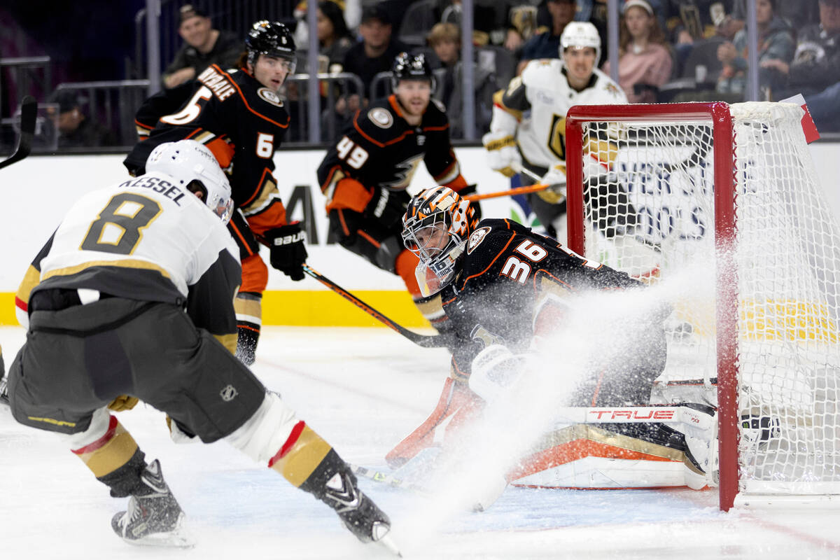 Golden Knights center Phil Kessel (8) attempts a goal against Ducks goaltender John Gibson (36) ...