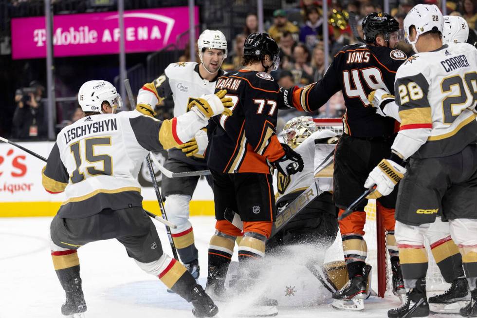 Ducks right wing Frank Vatrano (77) starts a conflict with Golden Knights goaltender Logan Thom ...