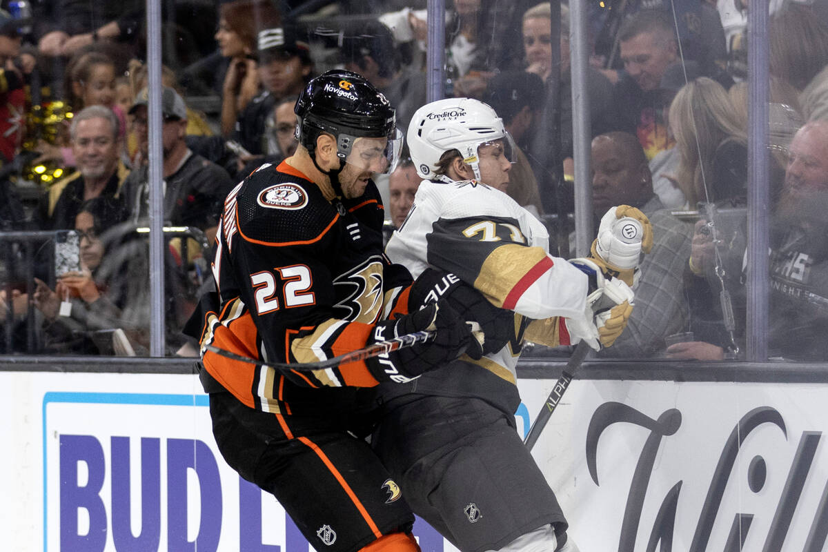 Ducks defenseman Kevin Shattenkirk (22) slams Golden Knights center William Karlsson (71) into ...