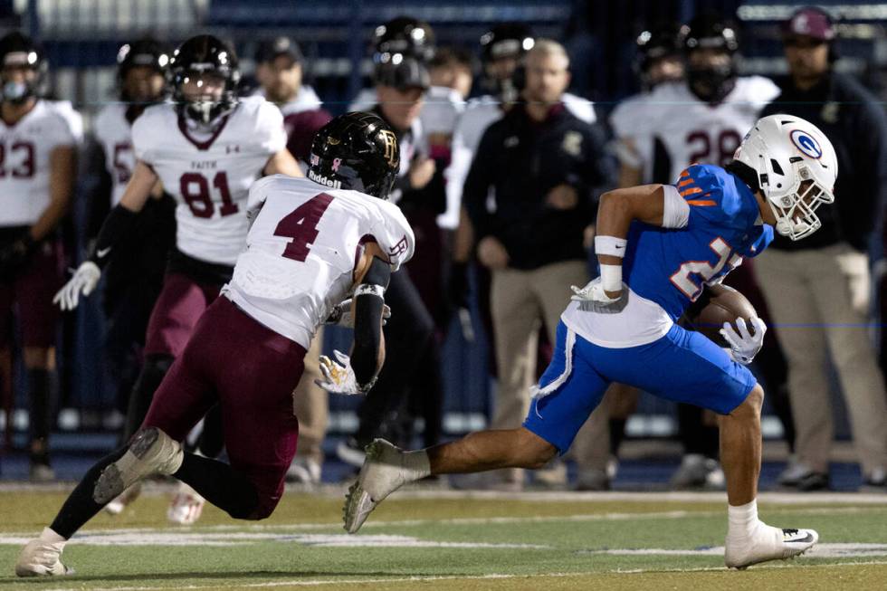 Bishop Gorman’s Micah Kaapana (22) evades a tackle by Faith Lutheran’s Vicentico ...