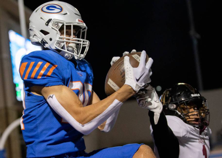 Bishop Gorman’s Derek Meadows (30) jumps to catch a touchdown pass while Faith Lutheran& ...