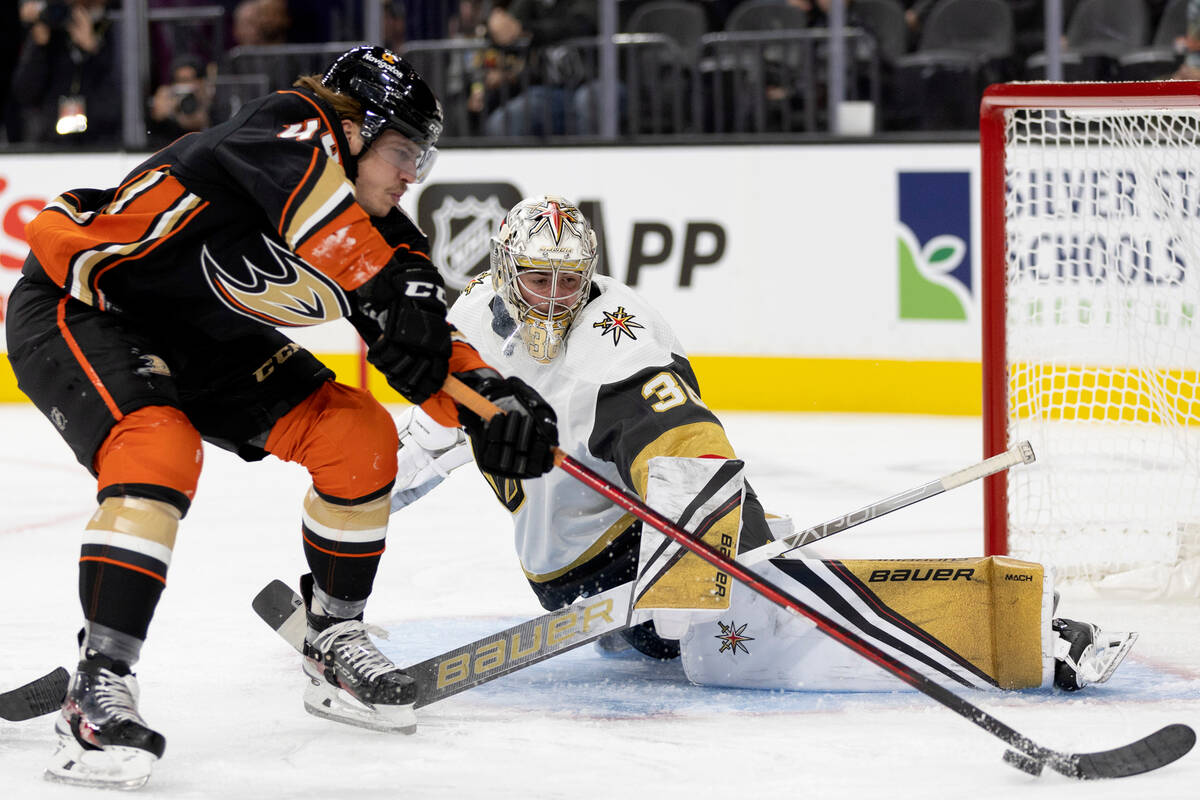 Golden Knights goaltender Logan Thompson (36) prepares to save a shot on goal by Ducks left win ...