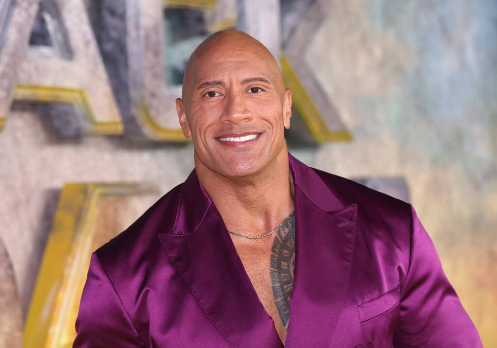 Dwayne Johnson poses for photographers upon arrival for the premiere of the film 'Black Adam' o ...