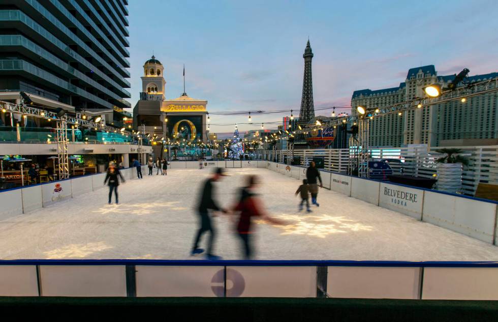 People enjoy some skating on the ice rink at The Cosmopolitan of Las Vegas on Monday, Dec. 2, 2 ...