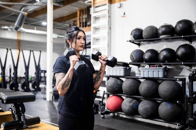 Building strength, one rep at a time: Martinez leads a session with Latina Lifters.