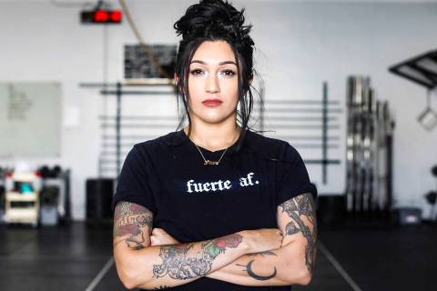 Martinez sports one of Latina Lifters’ signature T-shirts, translated as “Strong AF.” (Ph ...