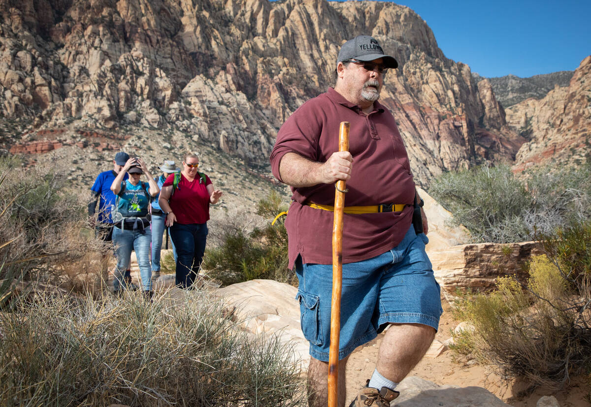 Richard Cumelis, founder of the Las Vegas Overweight Hikers for Health, leads an early morning ...