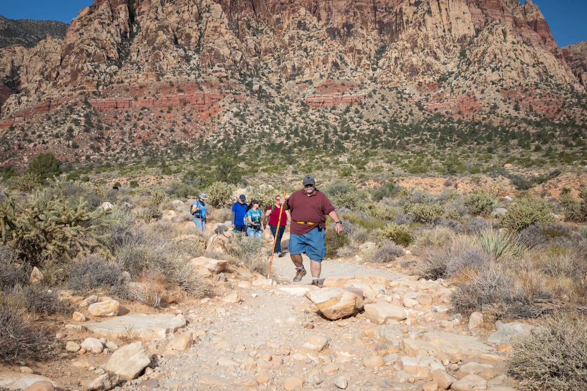 Richard Cumelis, founder of Las Vegas Overweight Hikers for Health, leads an early morning hike ...