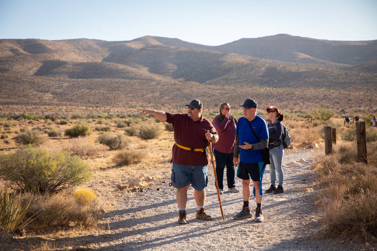 Richard Cumelis, front left, founder of the Las Vegas Overweight Hikers for Health, 59, points ...