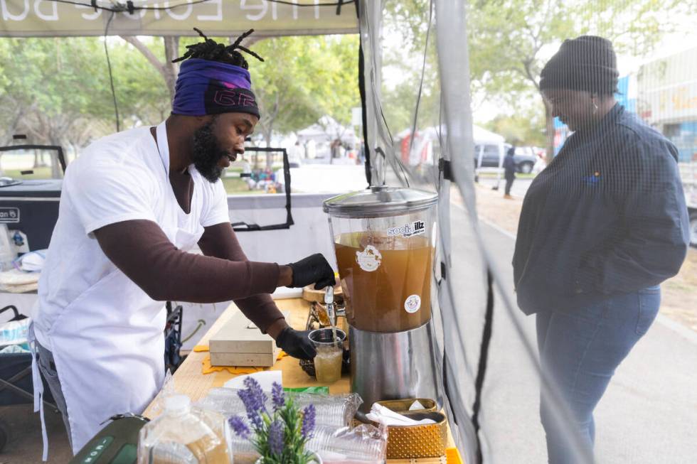 Myles Bunch, owner of a plant-based food business called The Edible Bunch, serves a lemonade fo ...