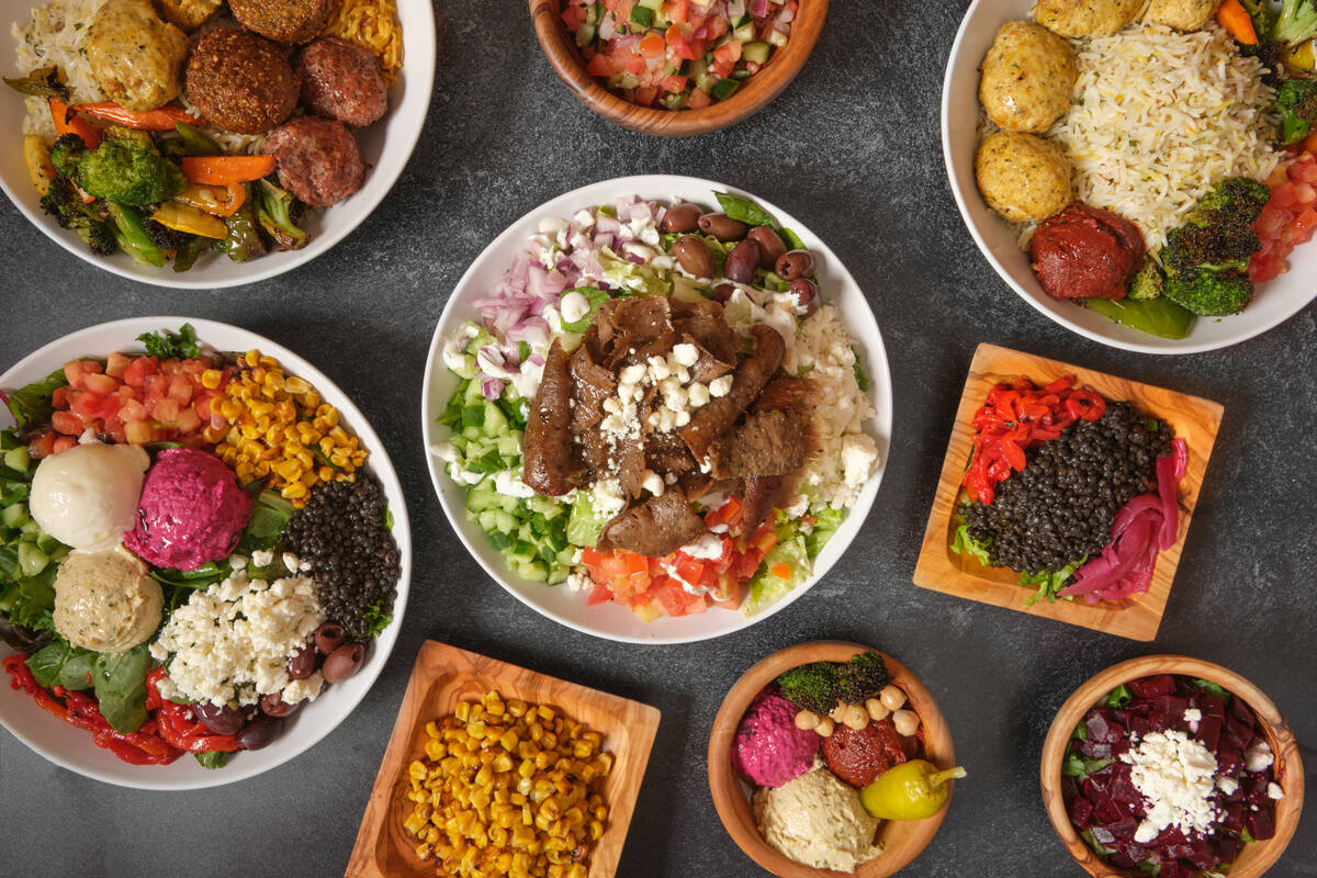 A spread of dishes from Paymon's Fresh Express, a fast-casual concept inside Paymon's Fresh Kit ...