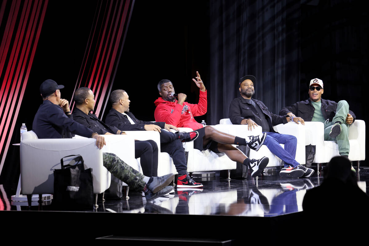 Chris Jacobs, left, hosts members of Kevin Hart’s Muscle Car Crew during the keynote on ...